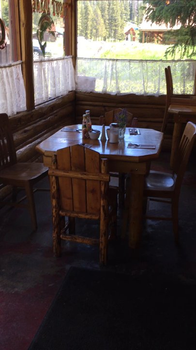 Log Cabin Cafe - Warming up in the sun, picnic tables in front - Cafes Near Me - Silver Gate, Montana