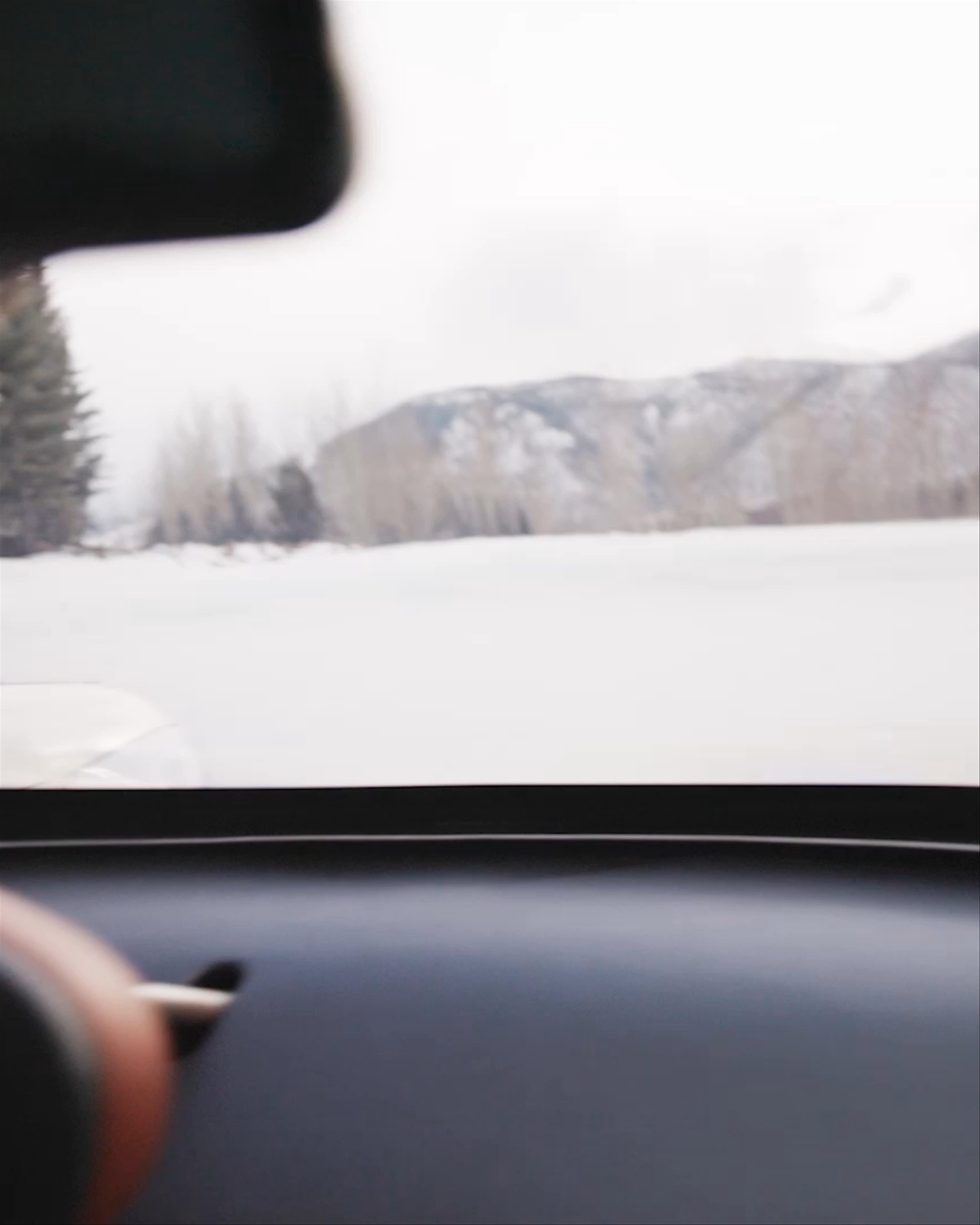 Video inside car of driver steering on the icy race track