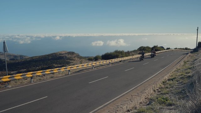 Bikers on a ride stop to look at the view