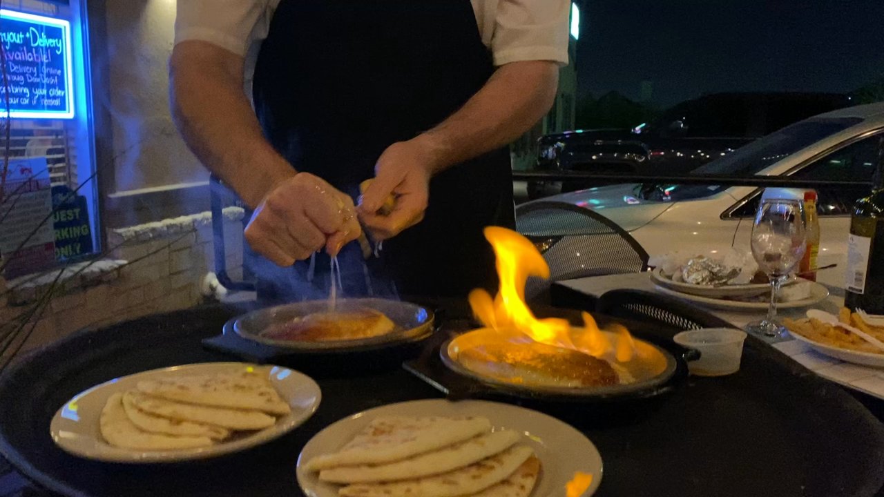 Aladdin Mediterranean Cafe - Saganaki Opa, flambé cheese with lemon. Soo tasty! - Mediterranean Near Me - Fort Worth, Texas