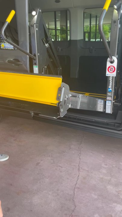 AMS Vans & Mobility - Showroom manager showing my wife and I how the wheelchair lift works - Mobility Equipment Sales & Services Near Me - Tucker, Georgia