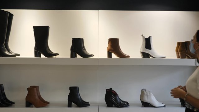 Woman looking at boots