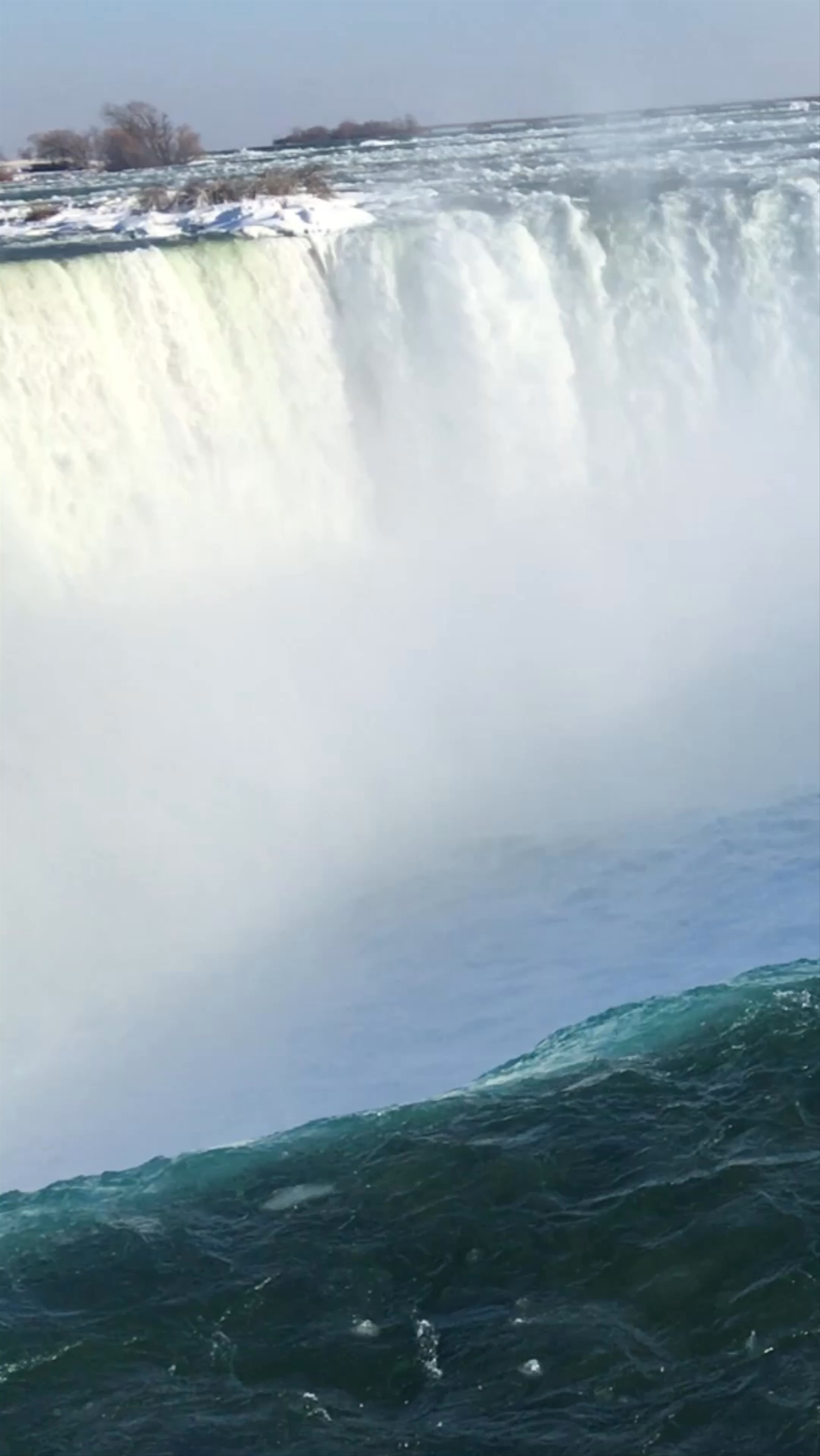 Winter Majesty at Niagara Falls - Frozen Edges and Rainbow Mist