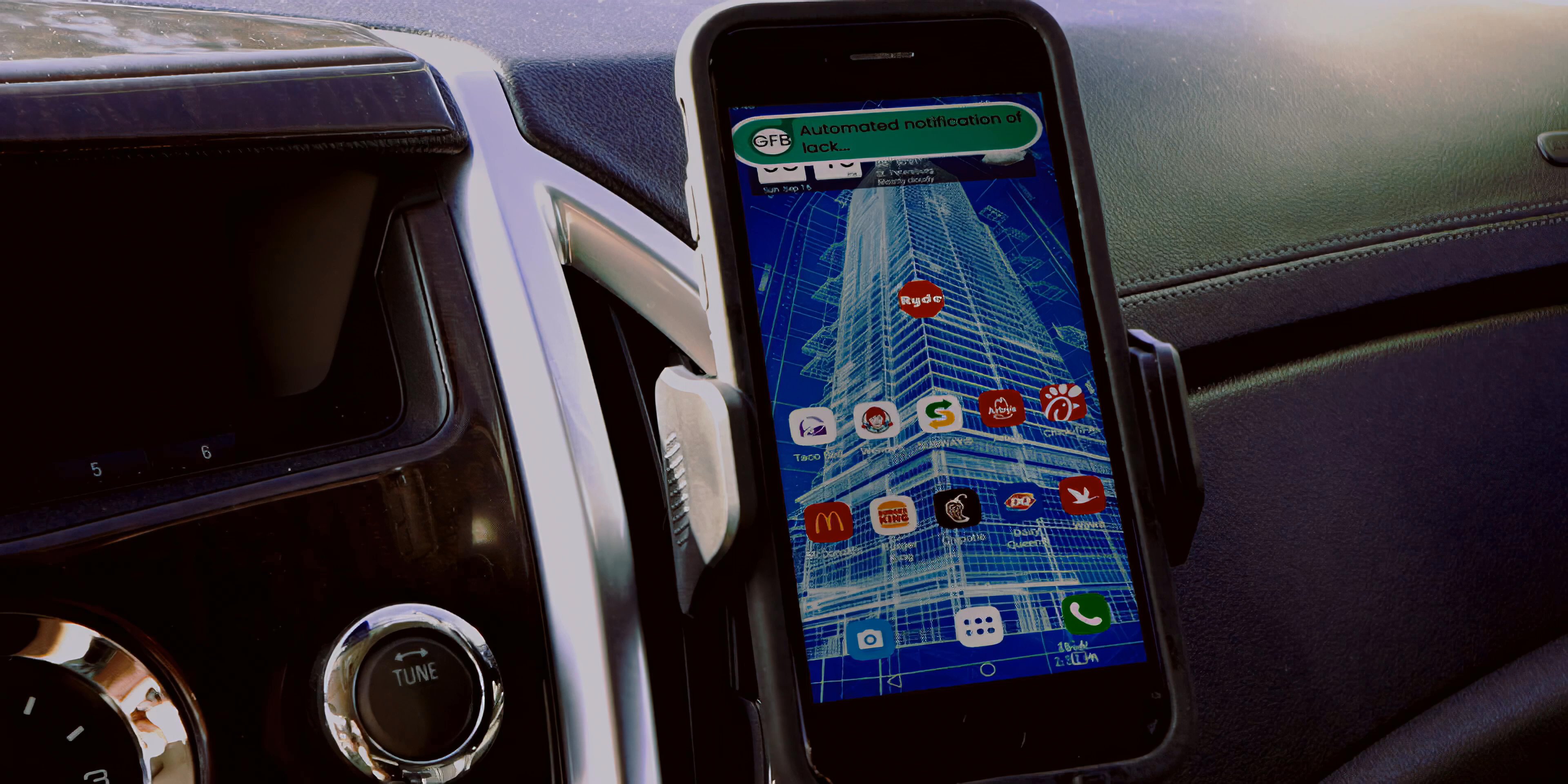 A passenger questions his rideshare driver while an automated mobile banking notification warning of insufficient funds and penalty fees appears on the driver's phone screen.