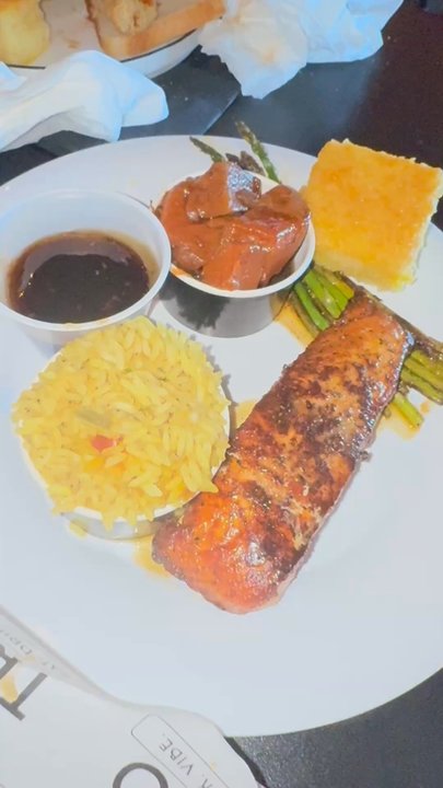 Trio - blackened salmon with asparagus and yellow rice, yams, cornbread, and a sweet honey teriyaki sauce didn't really care for that though - Soul Food Near Me - Huntsville, Alabama