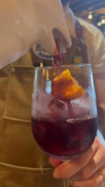 Malbec Market - Pouring my sangria from the penguin - Argentine Near Me - Eagle Rock, California