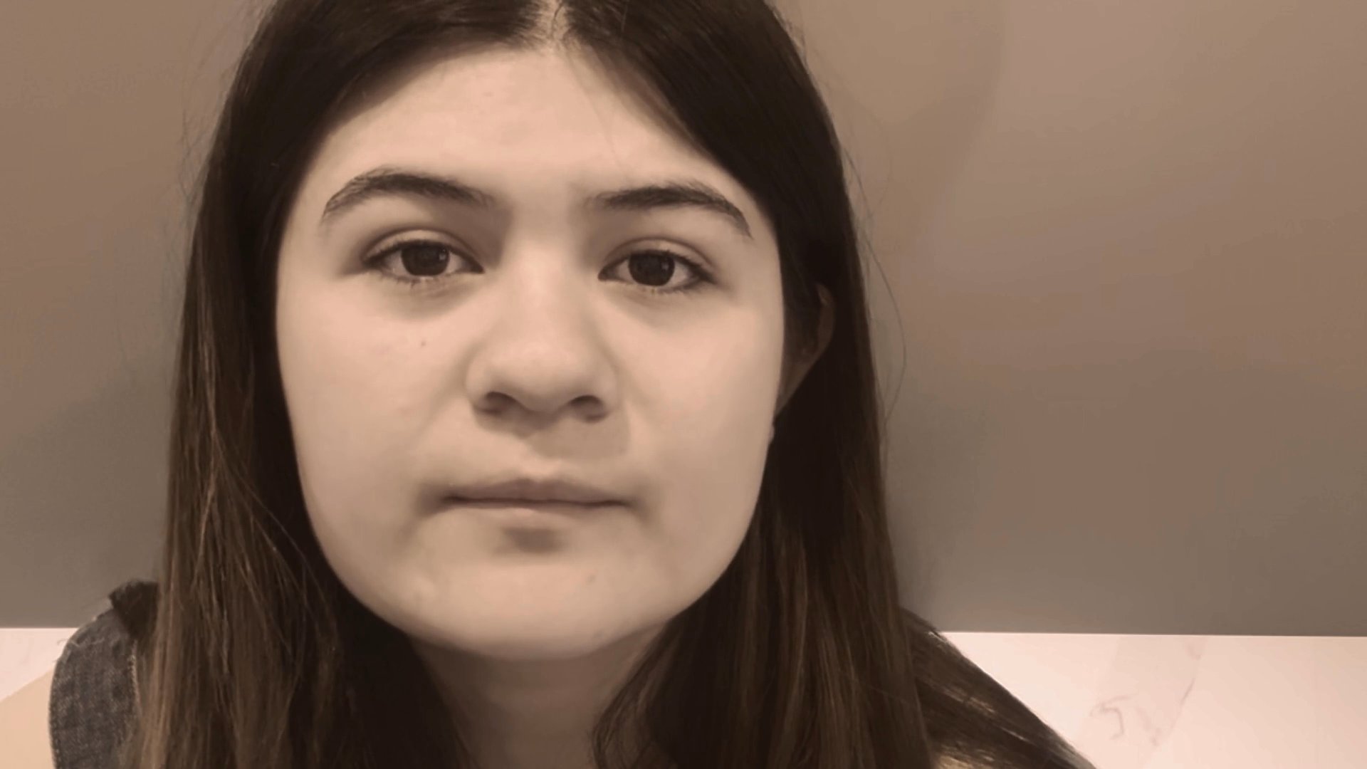 Two individuals speak directly to the camera in sequential, isolated segments, delivering personal narratives or commentary. The sequence shifts between subjects, emphasizing clear communication and individual expression.