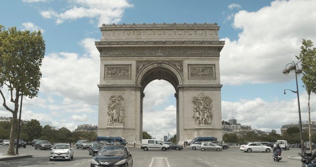 Cars driving near Arc de Triomphe in Paris 