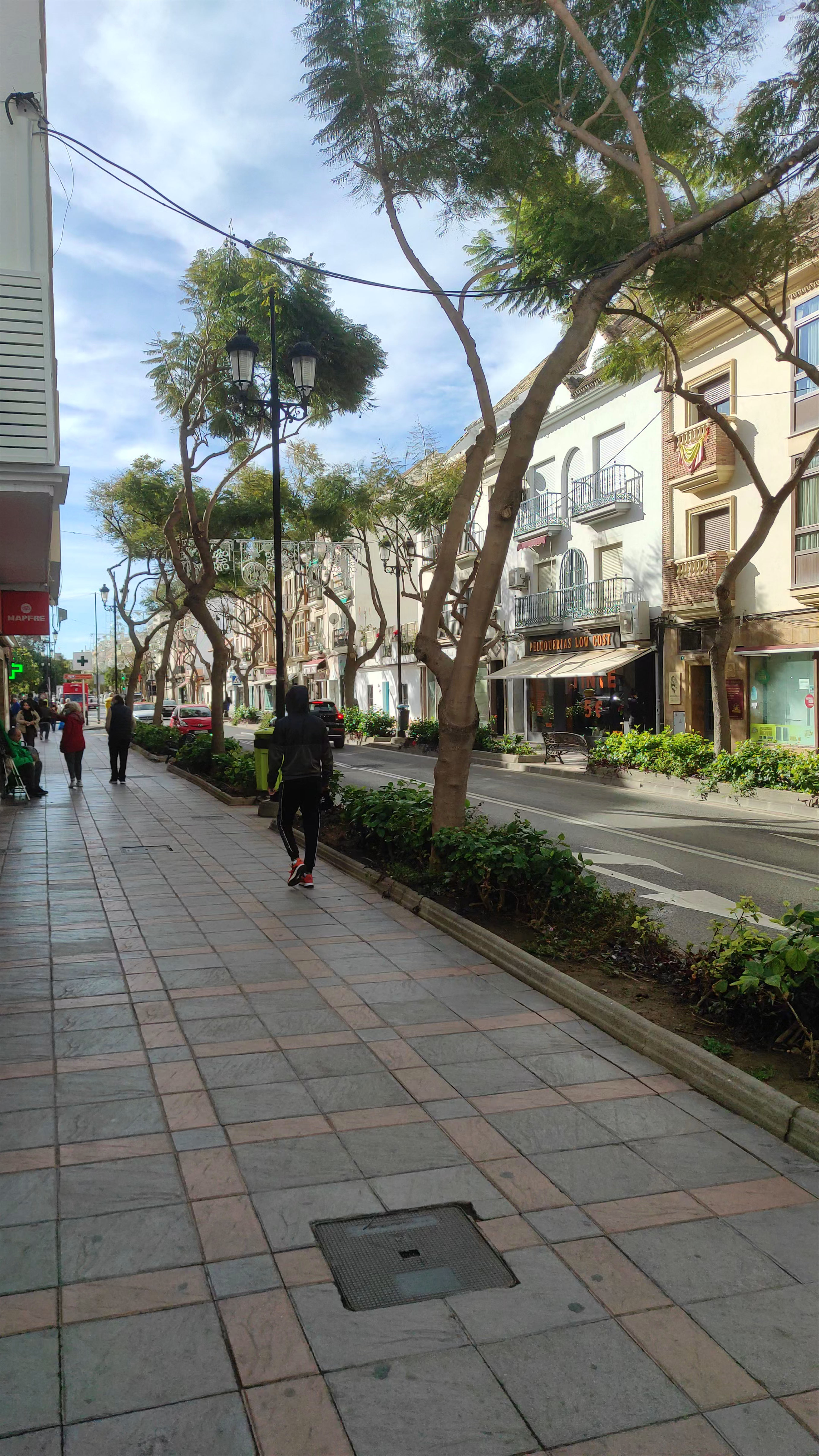 Sunny Stroll Along Av. Condes de San Isidro in Fuengirola, Spain