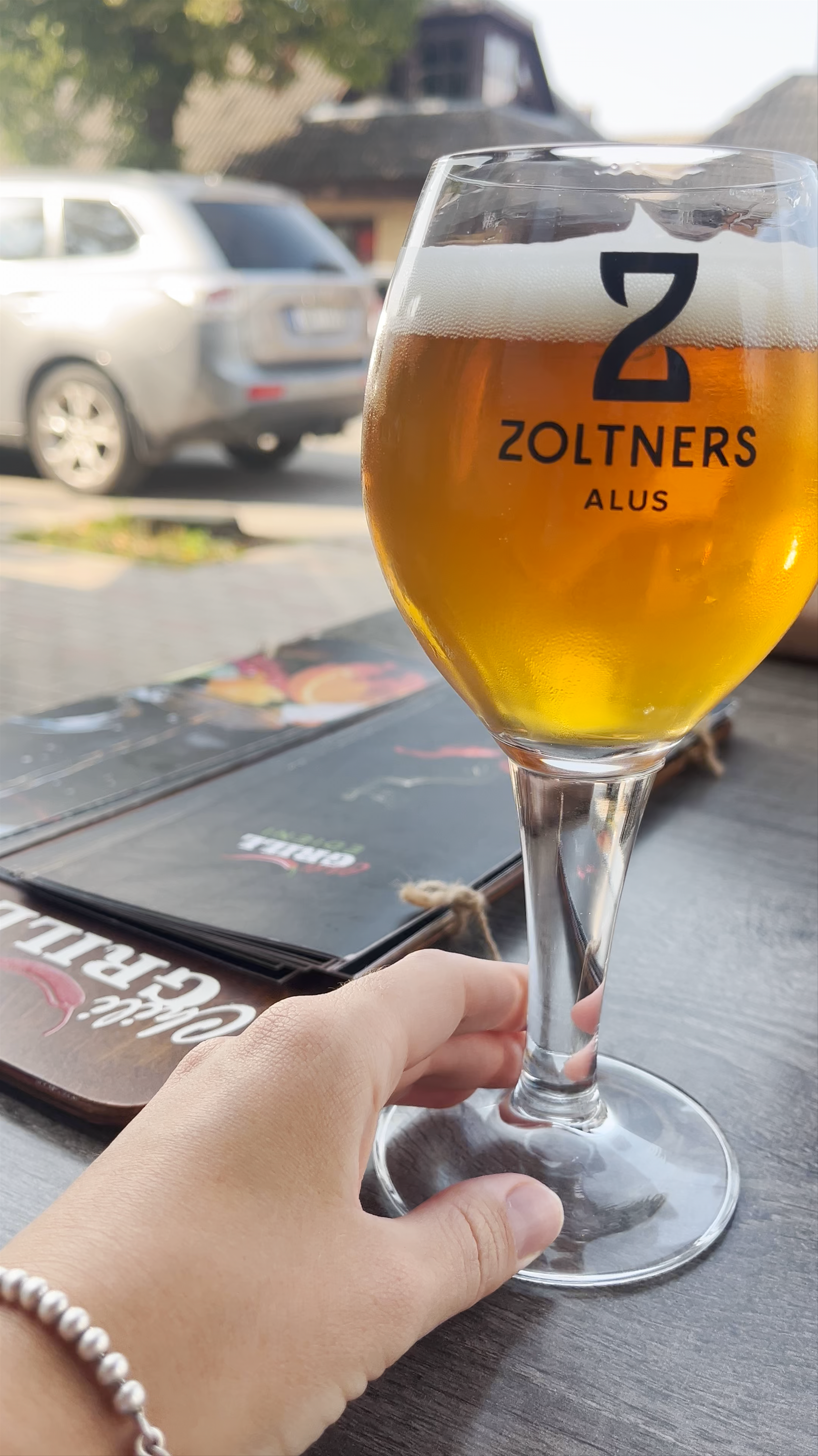 Relaxing Outdoor Beer Moment at Chili Grill in Tukums, Latvia