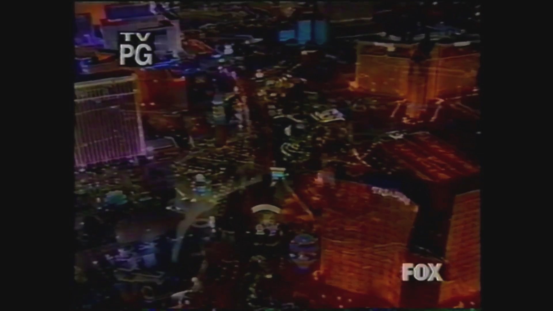 An aerial sequence captures the Las Vegas skyline transitioning into a nighttime view of the strip, featuring overlay graphics and production credits for a television program.