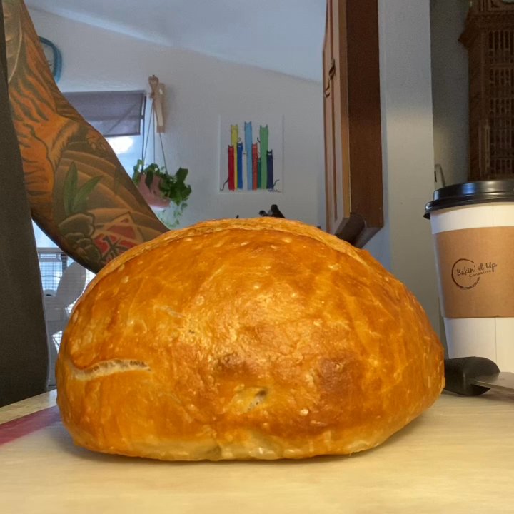 Bakin' It Up Collective - Slicing the original sourdough from Bakin' it up - Bakeries Near Me - Fallbrook, California