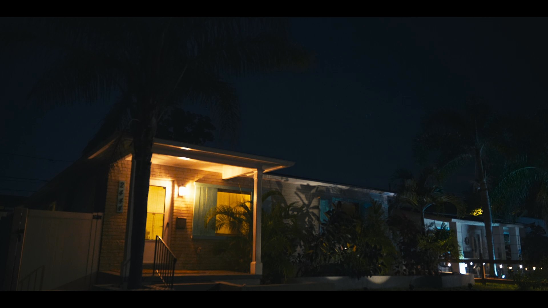 A man experiences a restless night of sleep in a motel room, struggling with insomnia and wakefulness during the late hours.