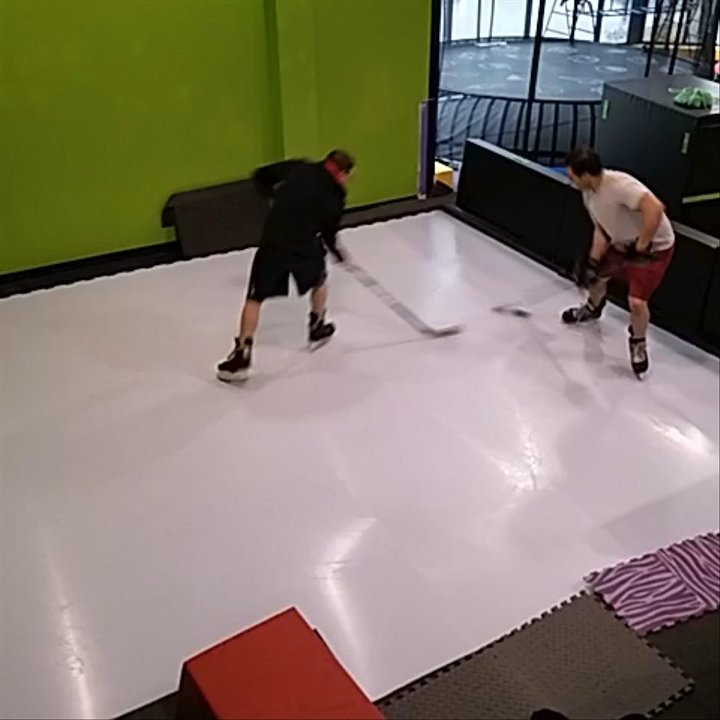 MOCO Movement Center - Julian and Avi playing hockey on our synthetic ice rink! - Physical Therapy Near Me - Kensington, Maryland