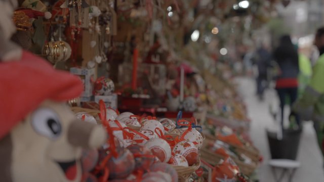 A girl looking at Christmas decorations while at the fair