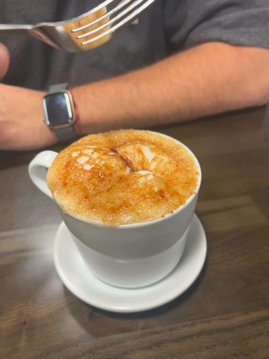 Soufflé Cafe & Bistro - Breaking the sugar on the cream brûlée latte, it cracked just like the dessert! - Cafes Near Me - Cibolo, Texas