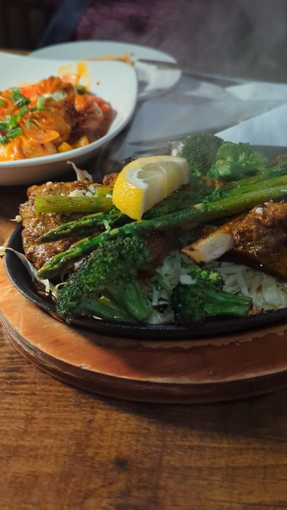 While in Kathmandu - Grilled Lamb Chops w.Timur Sauce, Veggies & White Rice (2 pcs/$26) - Bars Near Me - Glen Cove, New York