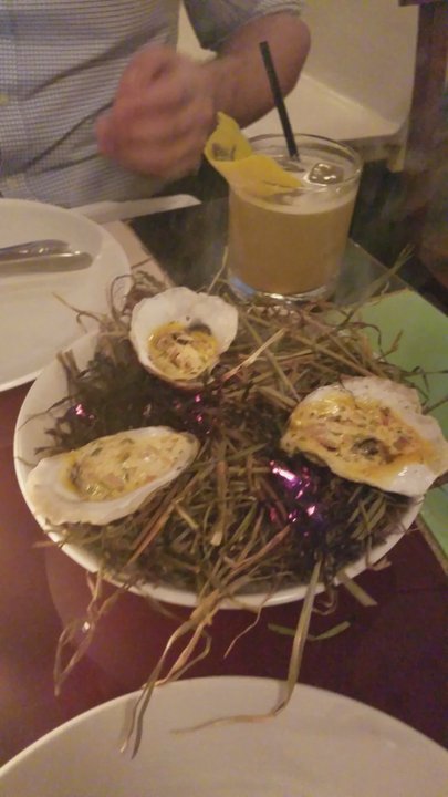 21 Greenpoint - oysters. underneath it theres a small fire with smoke steaming out - New American Near Me - Brooklyn, New York