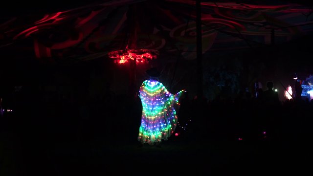 Man dancing in a lit-up costume