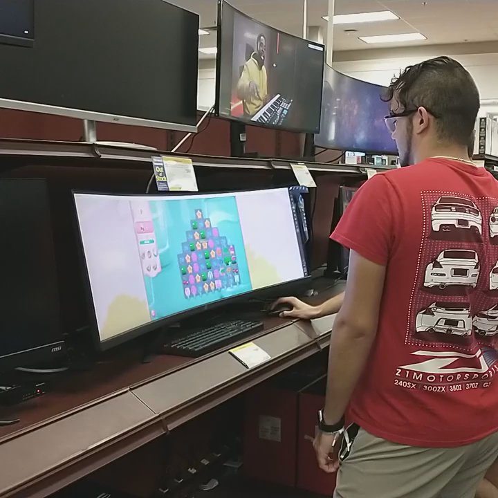 Micro Center - Watching curved monitor in action - Electronics Near Me - Houston, Texas