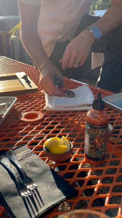 Shuck Shack - Shucking experience!!  Evan giving us an awesome demonstration on how to shuck your oysters - American Near Me - Avila Beach, California
