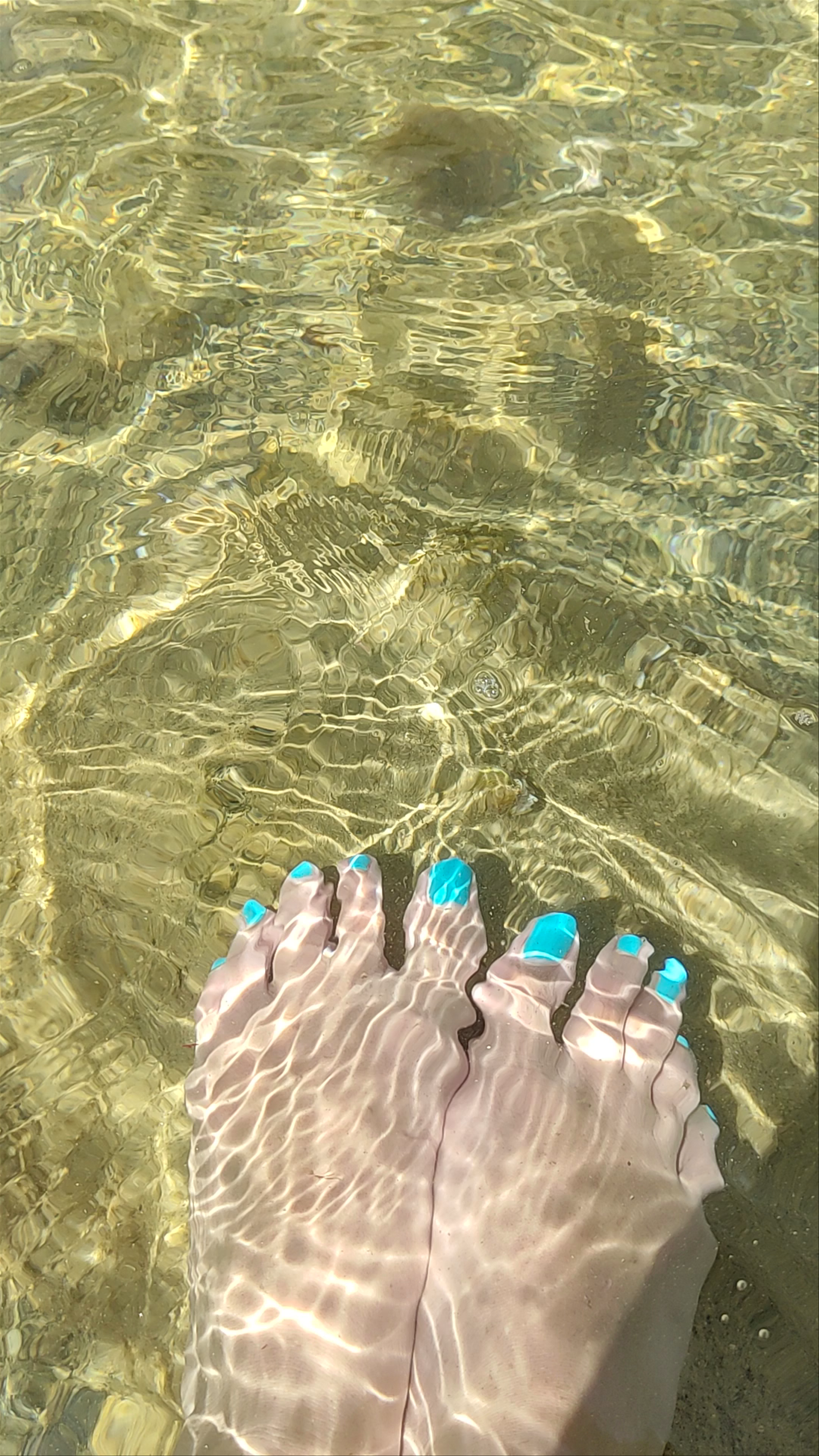 Crystal Clear Waters and Unique Rock Formations at Playa de los Cocedores