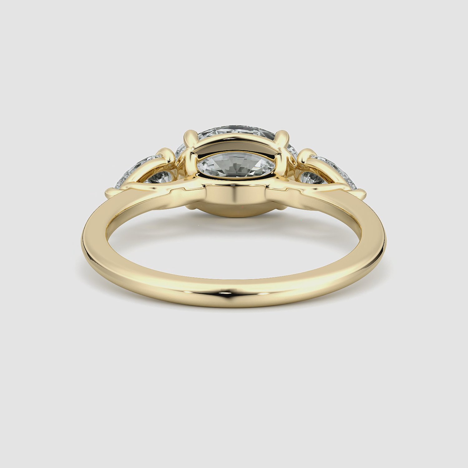 The Three Stone | Oval | 18k | Yellow Gold | bandAccent: Plain | diamondOrientation: horizontal | sideStoneCarat: 0.25ct | sideStoneShape: Pear | caratWeight: other