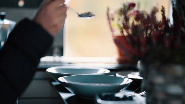 Putting oats in a bowl