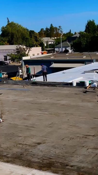 Bautista Roofing - Working on a comercial building. Single ply roofs. - Roofing Near Me