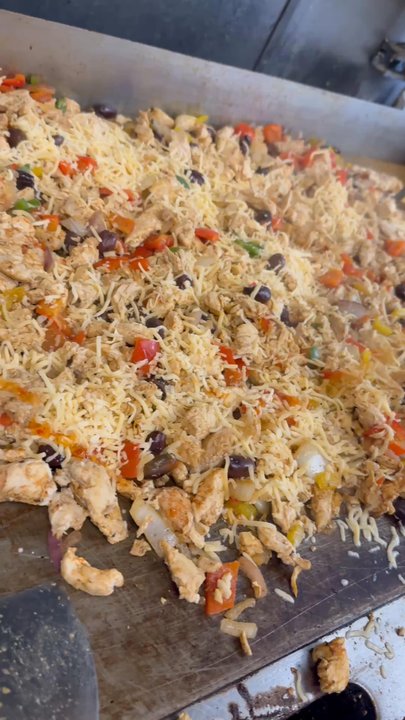 Zaytona Grill - Chicken shawarma mixed with veggies & a lot of cheese at Zaytona Grill - Mediterranean Near Me - Miami, Florida