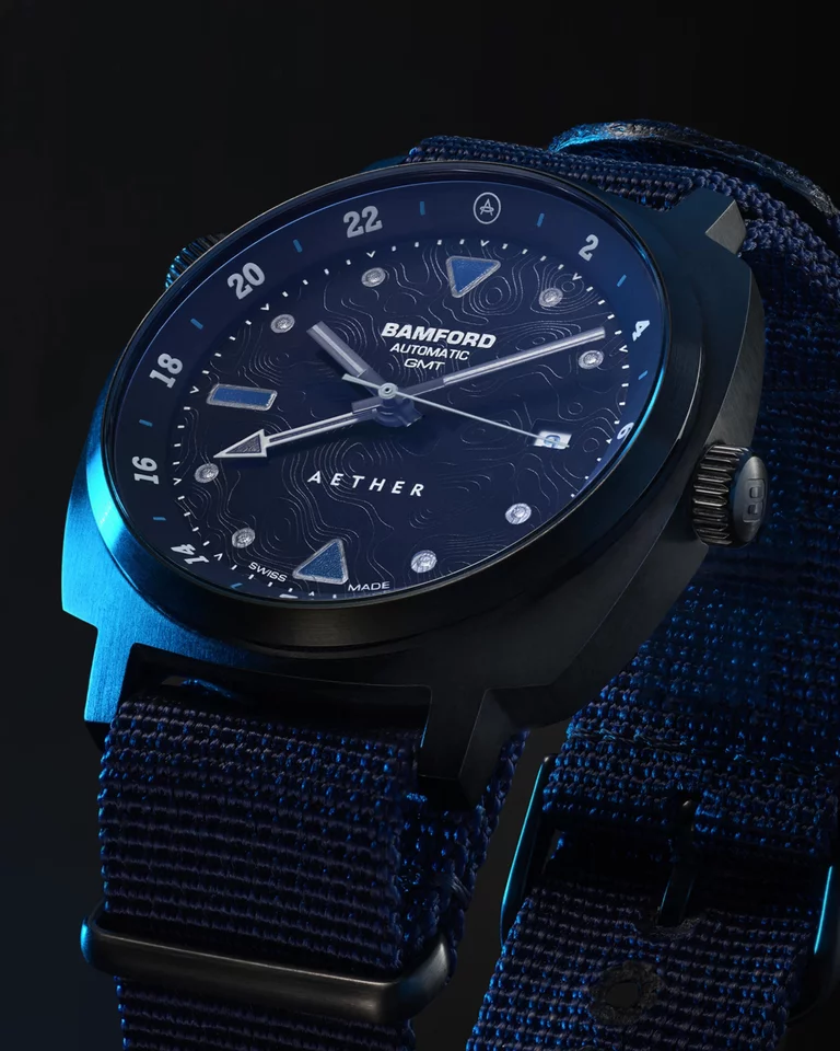 Studio closeup of AETHER + Bamford GMT watch with seconds hand rotating 