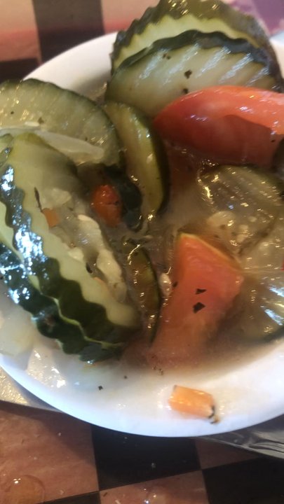 Super Smokers BBQ - Cucumber (pickles) and tomato salad in a watery base and greasy cheesy potatoes. - Barbeque Near Me - Eureka, Missouri