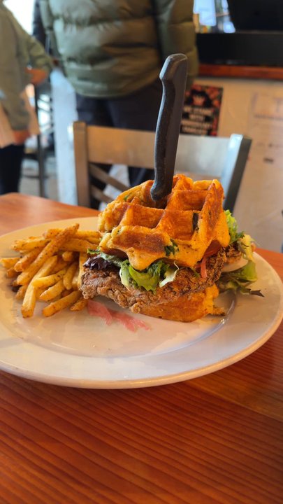 Gigi's Cafe - Chicken and waffle sandwich with Cajun fries - Cafes Near Me - Portland, Oregon