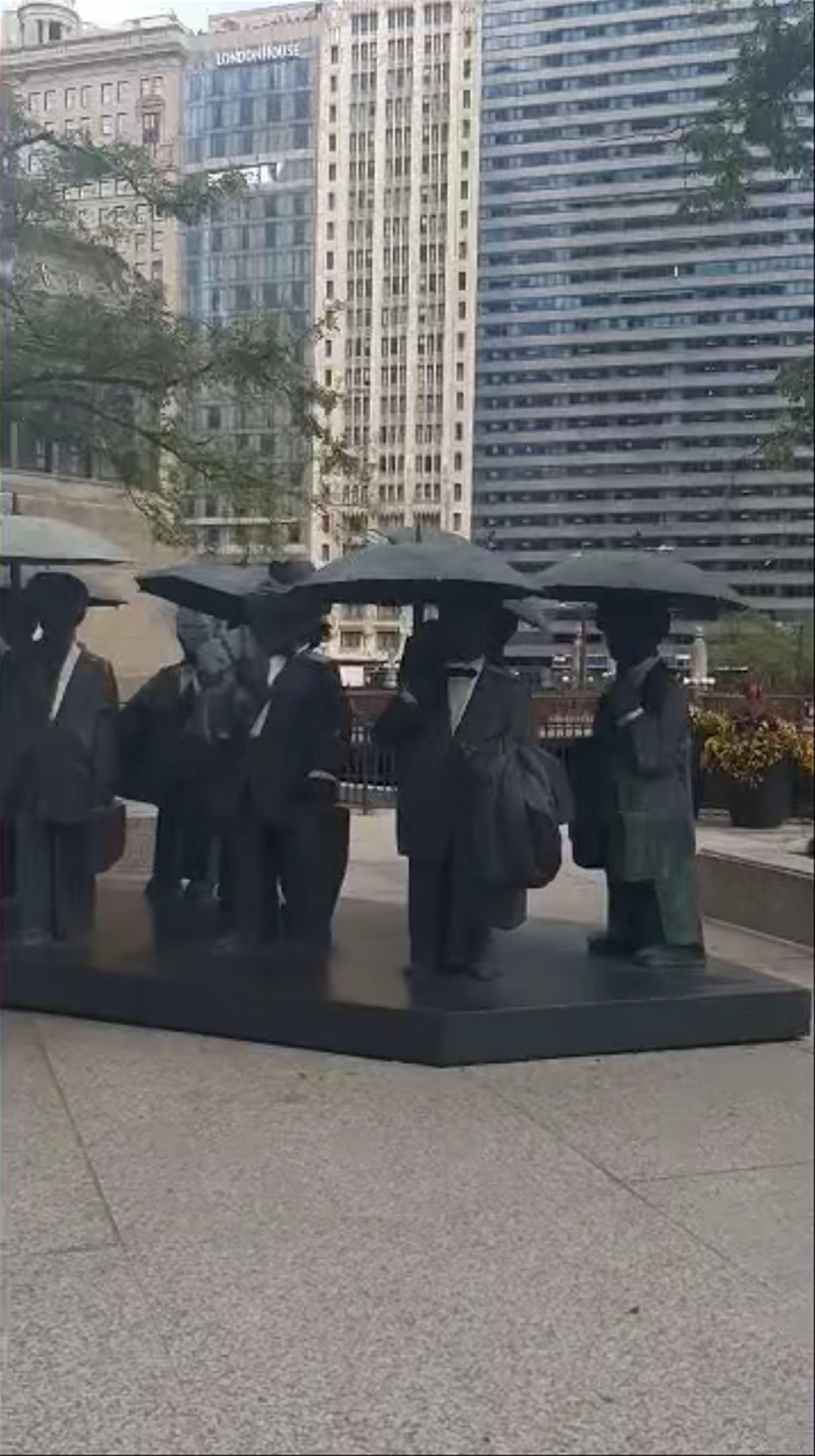 Iconic Chicago Sculpture: People with Umbrellas at AMA Plaza