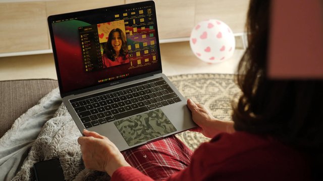 Woman using FaceTime on a MacBook
