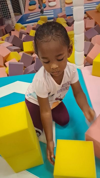 Go Bonkers - Parent laying in the sponge pit 2 hours on his phone - Indoor Playcenter Near Me - Aurora, Colorado