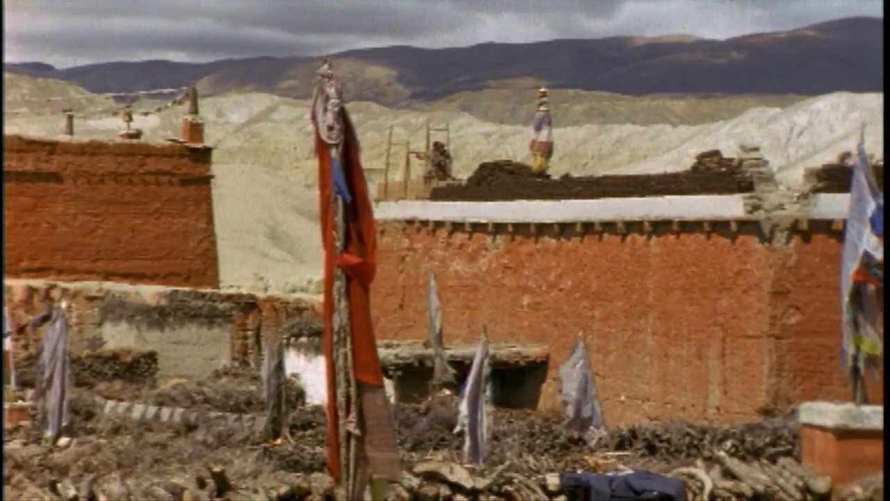 A group of travelers navigates a bustling market square near a prominent Buddhist stupa before exploring the interior of a historic monastery.