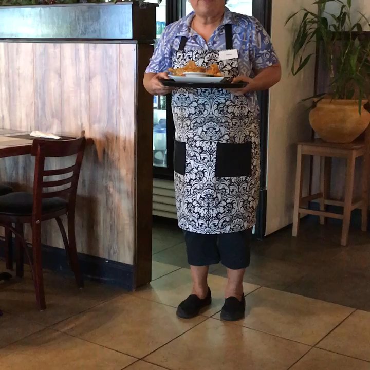 Thai Legacy Restaurant - The sweet owner bringing me my DELICIOUS stuffed chicken wings, and having fun doing it. They are sooo good! - Thai Near Me - Brandon, Florida