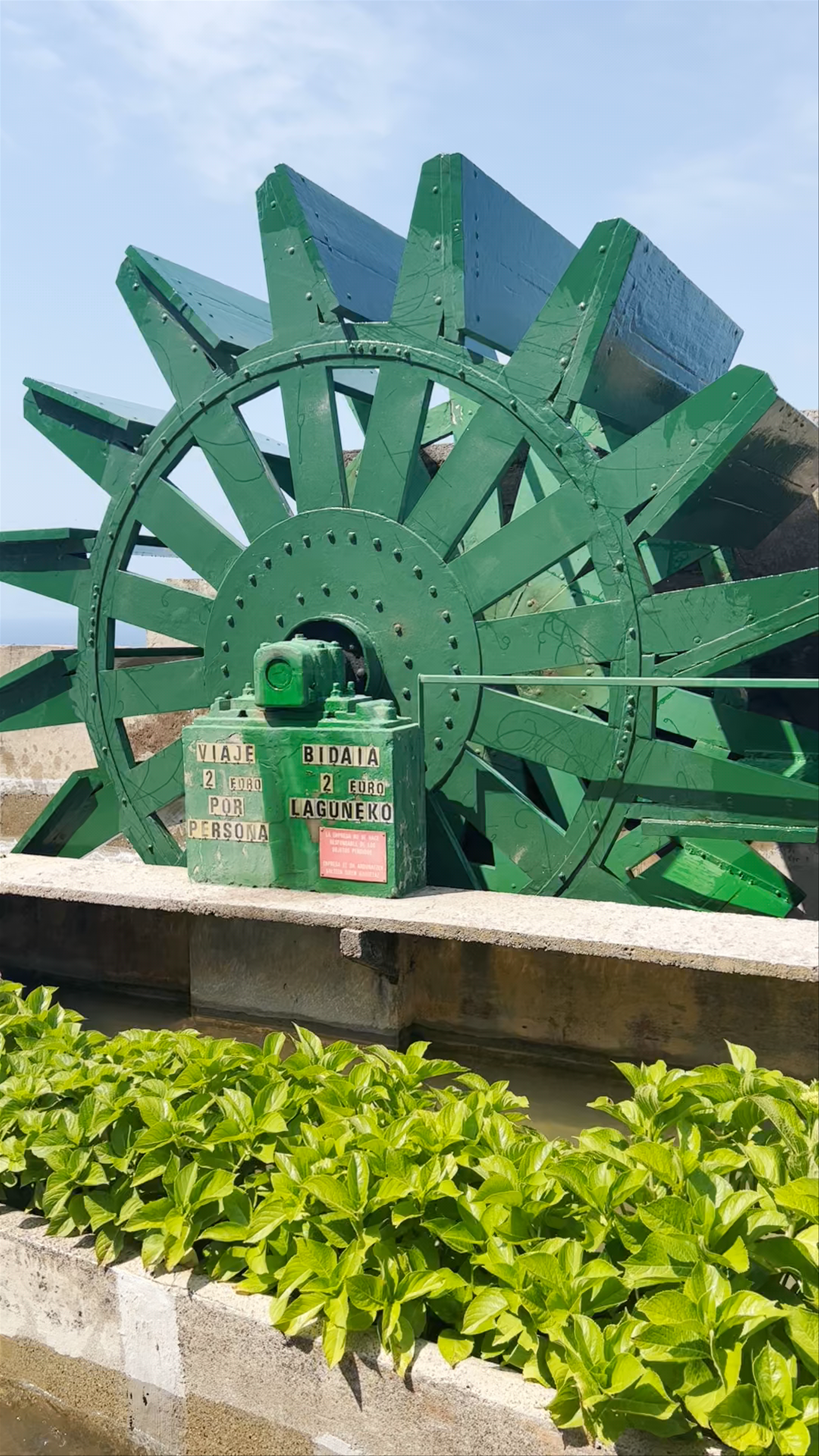 Scenic Views and Iconic Water Wheel at Parque de Atracciones Monte Igueldo in San Sebastián