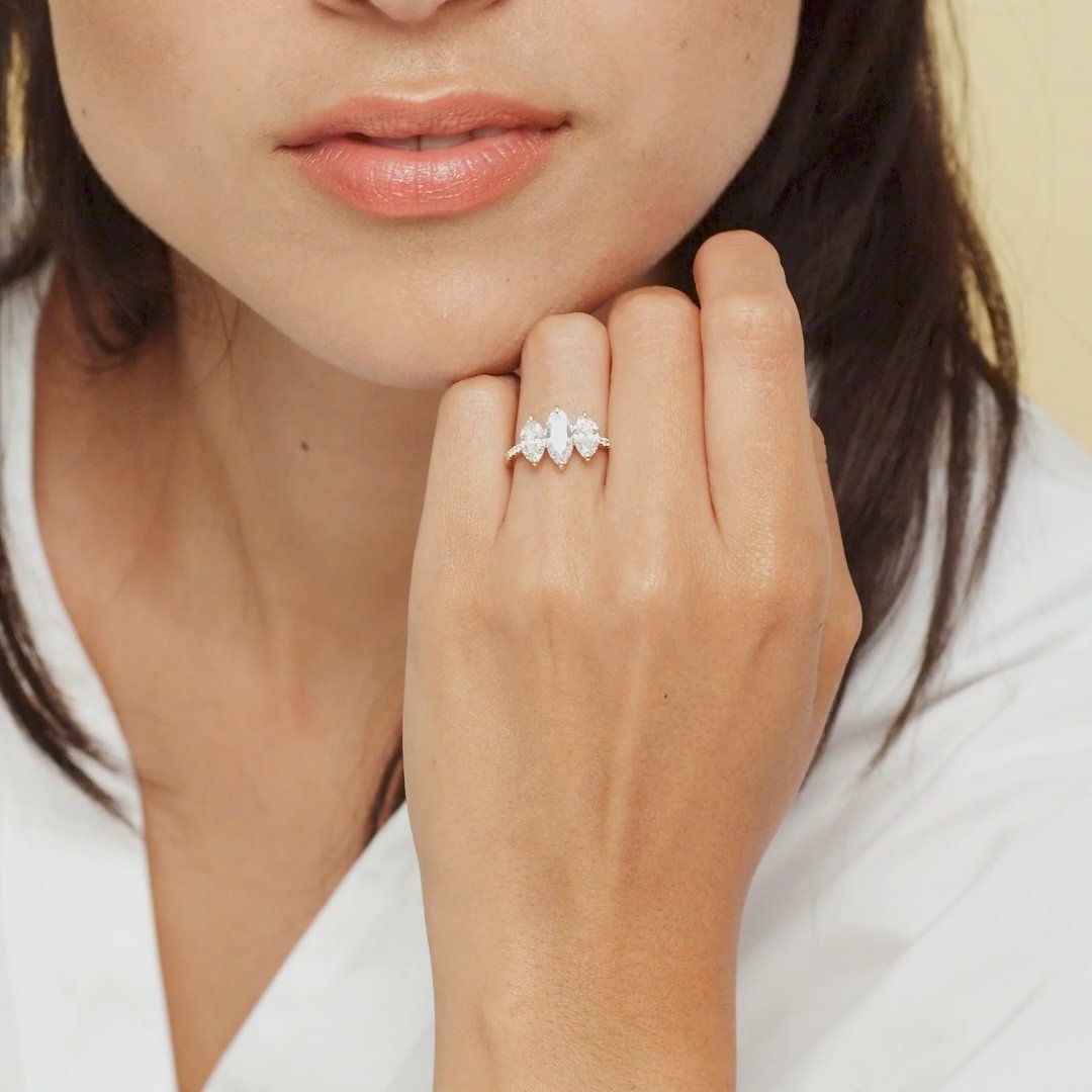 The Three Stone | Marquise | 18k | White Gold | bandAccent: Pavé | sideStoneCarat: 0.50ct | sideStoneShape: Marquise | diamondOrientation: vertical | caratWeight: other