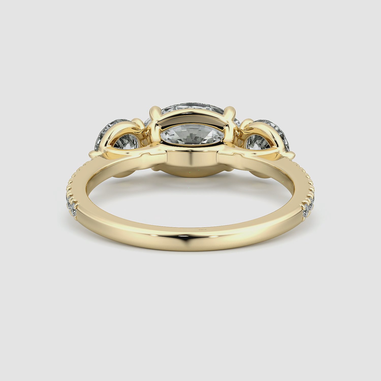 The Three Stone | Oval | 18k | Yellow Gold | bandAccent: Pavé | diamondOrientation: horizontal | sideStoneCarat: 0.50ct | sideStoneShape: Round Brilliant | caratWeight: other