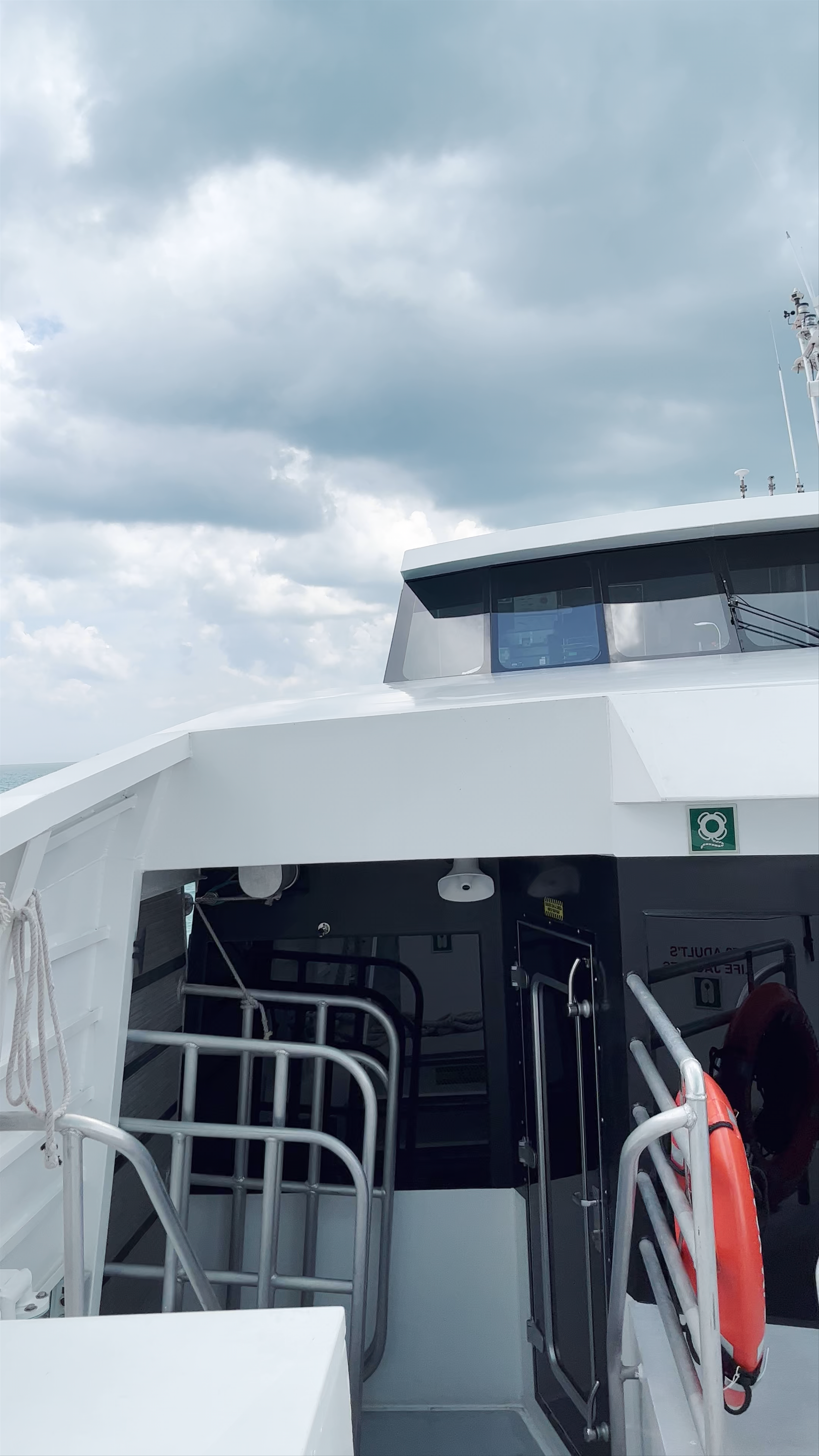 Ferry Ride to Isla Mujeres from Cancún: Ocean Views and Cloudy Skies