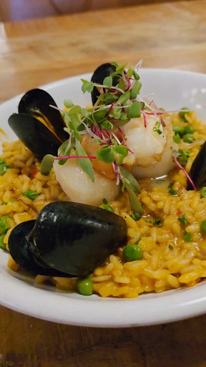 Sidecar - A Video Clip of The Spanish Seafood Risotto main entrée. - Modern European Near Me - Roanoke, Virginia
