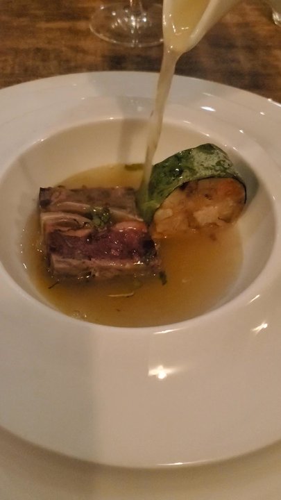 ADEGA Restaurant - Server pouring broth over meat terrine. - Portuguese Near Me - San Jose, California