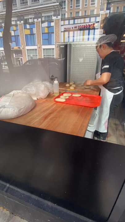 Li‘s Knife Cut Noodle - Video of pastry making in front window. - Chinese Near Me - Berkeley, California