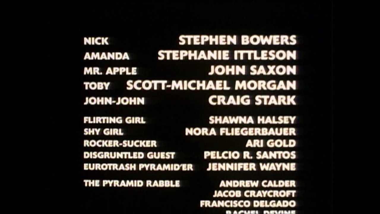 A woman relaxes poolside in the opening frames before the sequence transitions into a comprehensive display of the motion picture's closing credits.