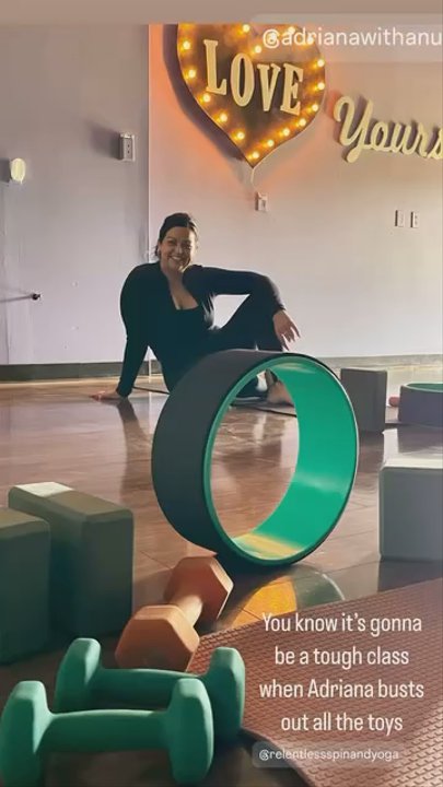 Relentless Spin - Adriana teaching a fun yoga class with a yoga wheel - Trainers Near Me - Apple Valley, California