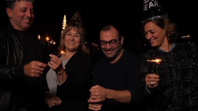 Opening champagne bottle on New Year's Eve