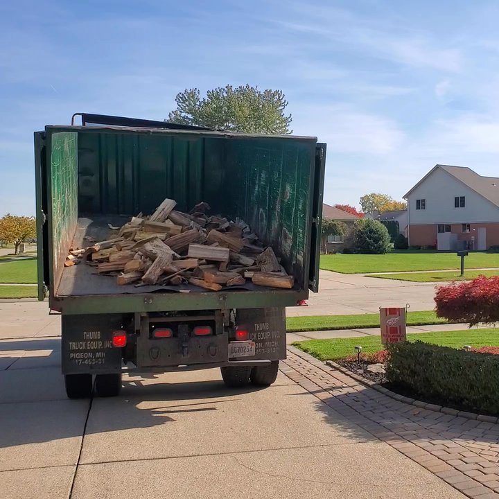 PJ Hebert - Truck doors opened, firewood is ready to dump and unload.  Saturday, 10/22/2022 - Landscaping Near Me - Shelby Township, Michigan