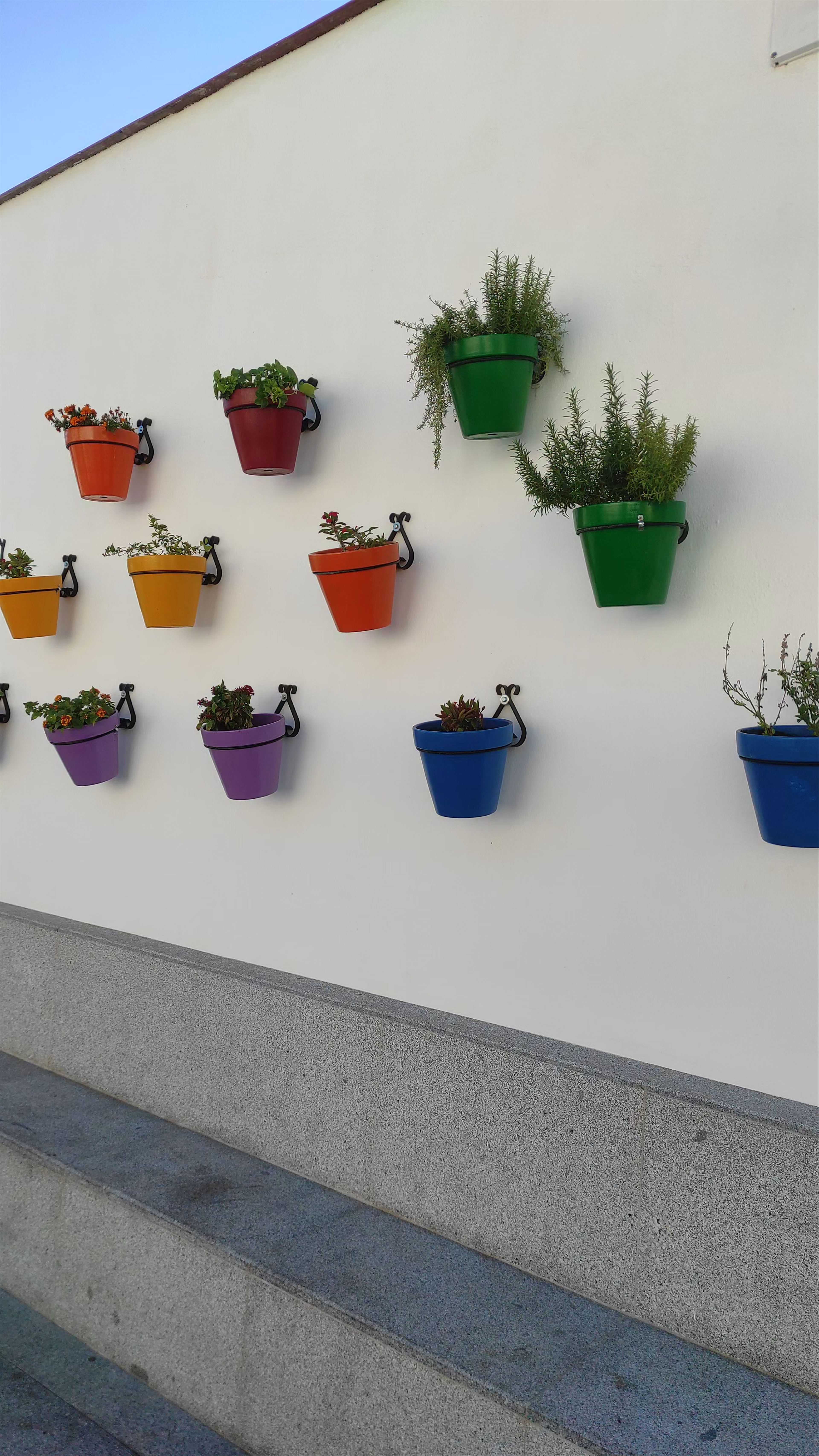 Colorful Wall Pots and Sunny Plaza in Mijas, Spain